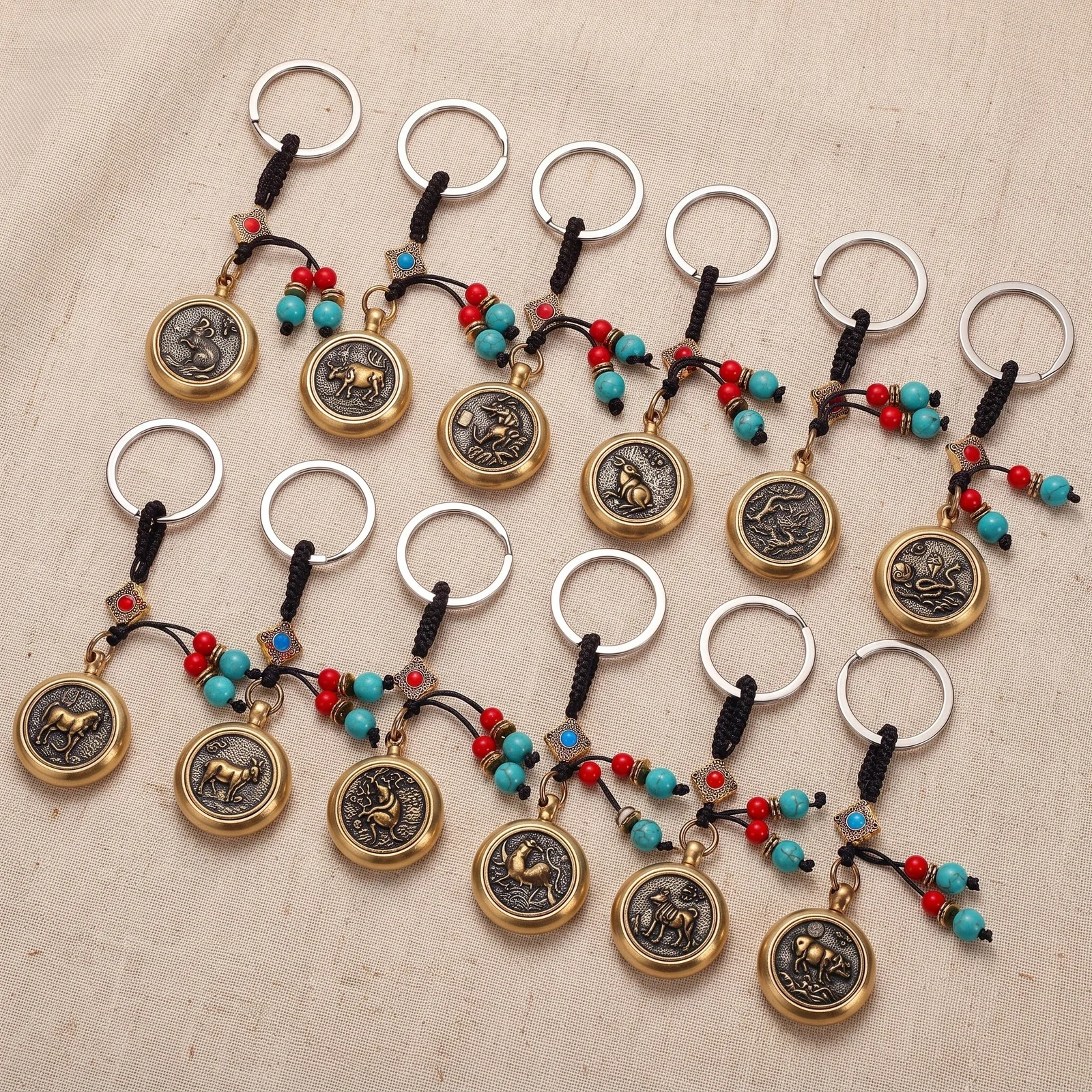 Spinning Zodiac Coin with Green Bead Keychain