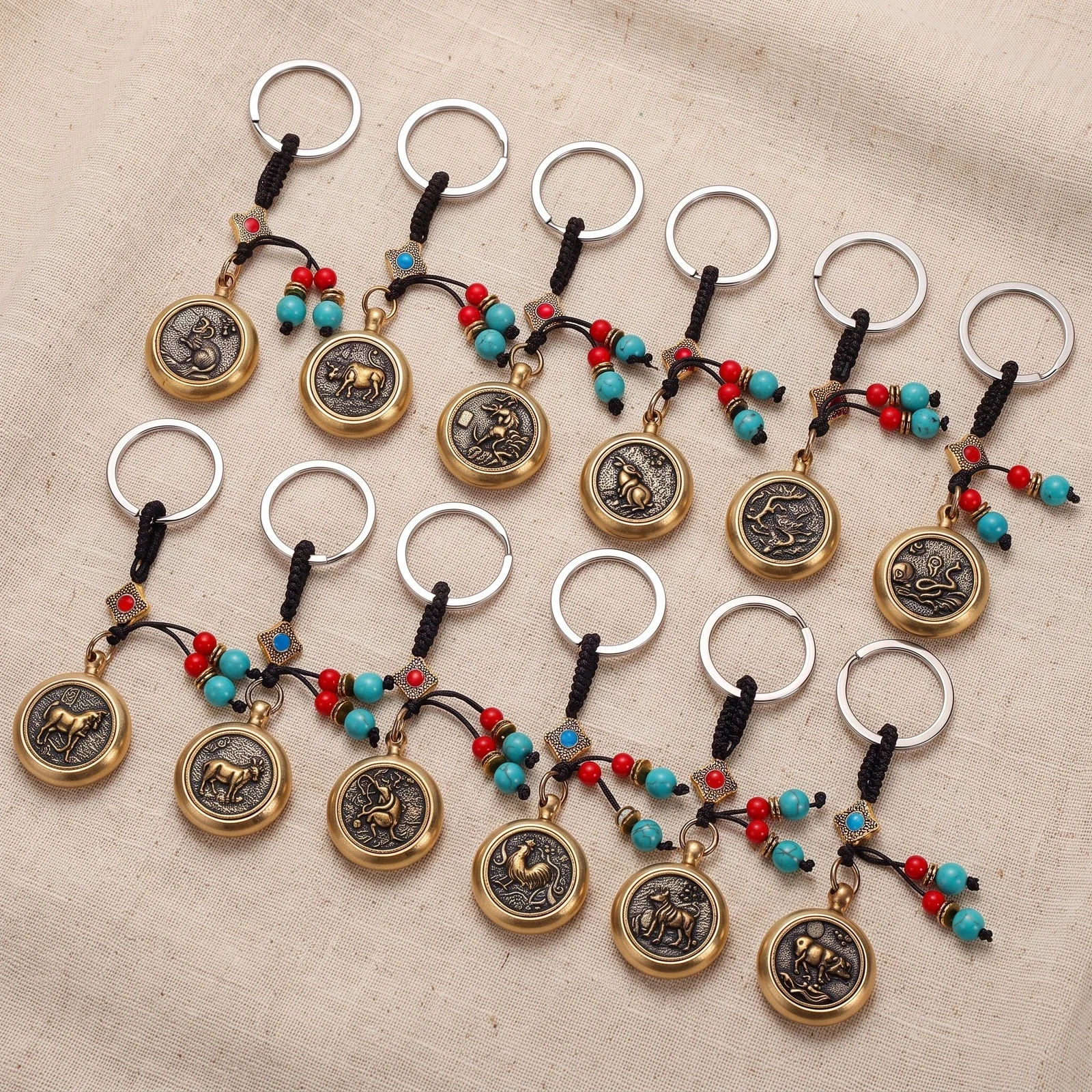 Spinning Zodiac Coin with Green Bead Keychain — photo 3